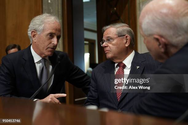 Sen. Bob Corker , chairman of the Senate Foreign Relations Committee, discusses with ranking member Sen. Bob Menendez prior to a committee meeting...