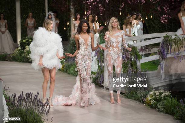 Models Keke Lindgard, Cindy Bruna and Devon Windsor walk the runway for Pronovias during Barcelona Bridal Fashion Week at Fira de Barcelona on April...