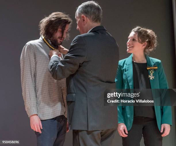 Portuguese singer and composer Luisa Sobral smiles while her brother Salvador Sobral is decorated by Portuguese President Marcelo Rebelo de Sousa...