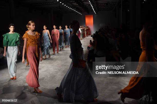 Models present creations by Lilly Sarti during the Sao Paulo Fashion Week in Sao Paulo, Brazil, on April 23, 2018.