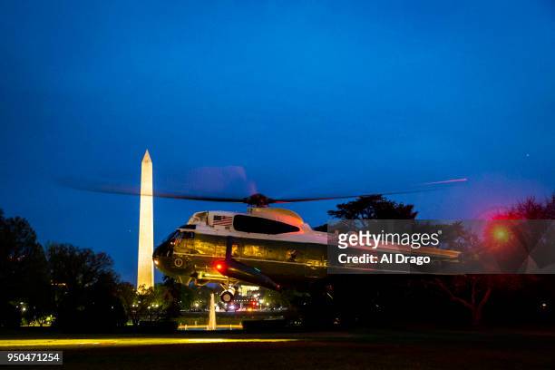 Marine One, carrying President Donald Trump, French President Emmanuel Macron, Brigitte Macron, and first lady Melania Trump arrives on the South...