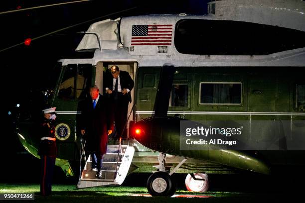 President Donald Trump and French President Emmanuel Macron arrive aboard Marine One on the South Lawn of the White House, after traveling to Mount...