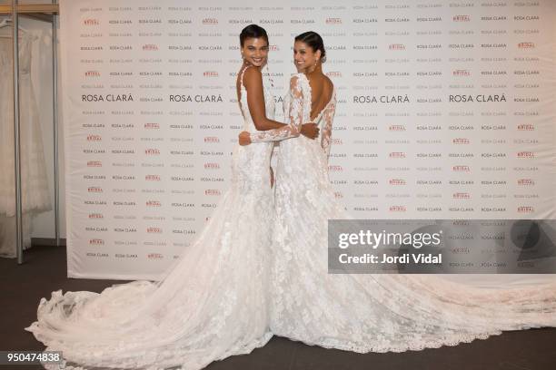 Models Daniela Braga and Bruna Liria pose for Rosa Clara Fitting during Barcelona Bridal Fashion Week at Fira de Barcelona on April 23, 2018 in...