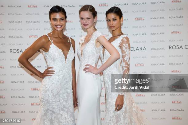 Models Daniela Braga, Matiu and Bruna Liria pose for Rosa Clara Fitting during Barcelona Bridal Fashion Week at Fira de Barcelona on April 23, 2018...