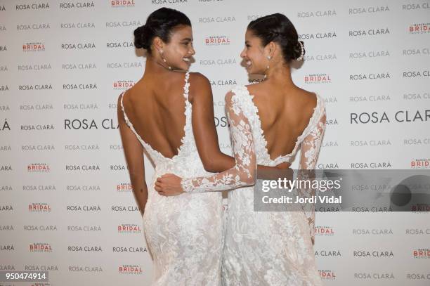 Models Daniela Braga and Bruna Liria pose for Rosa Clara Fitting during Barcelona Bridal Fashion Week at Fira de Barcelona on April 23, 2018 in...