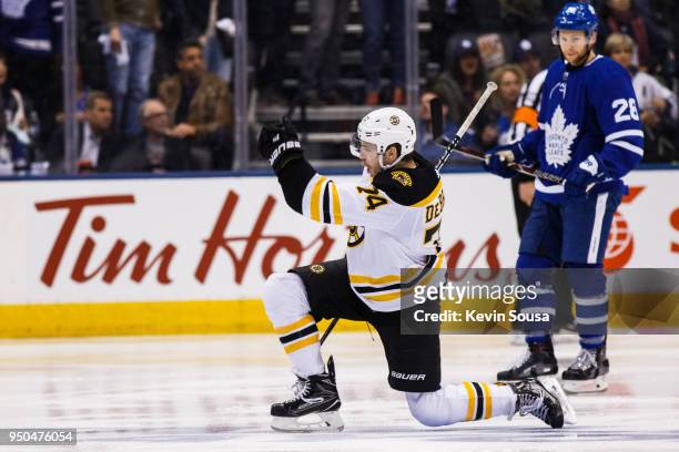 Jake DeBrusk of the Boston Bruins celebrates his goal as Connor Brown of the Toronto Maple Leafs looks on in Game Six of the Eastern Conference First...