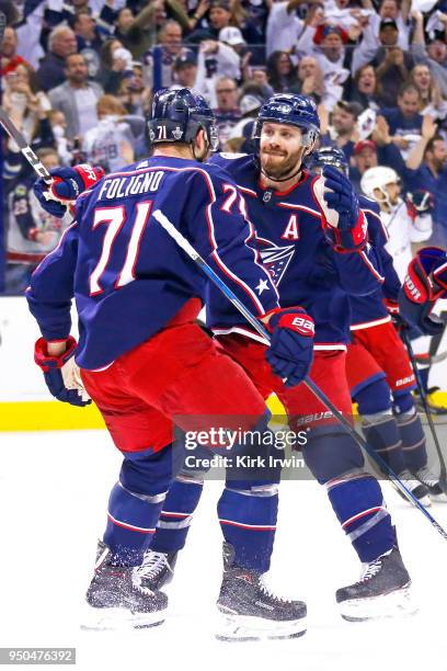 Nick Foligno of the Columbus Blue Jackets is congratulated by Boone Jenner of the Columbus Blue Jackets after scoring a goal during the second period...