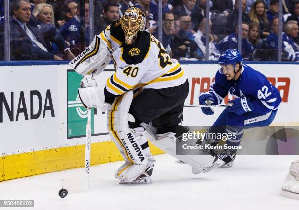 Tuukka Rask of the Boston Bruins handles the puck under pressure from Tyler Bozak of the Toronto Maple Leafs in Game Six of the Eastern Conference...