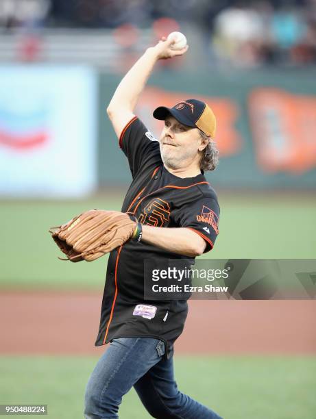 Lars Ulrich, the drummer of Metallica, throws out the ceremonial first pitch before the San Francisco Giants game against the Washington Nationals at...