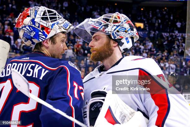 Sergei Bobrovsky of the Columbus Blue Jackets congratulates Braden Holtby of the Washington Capitals at the end of Game Six of the Eastern Conference...
