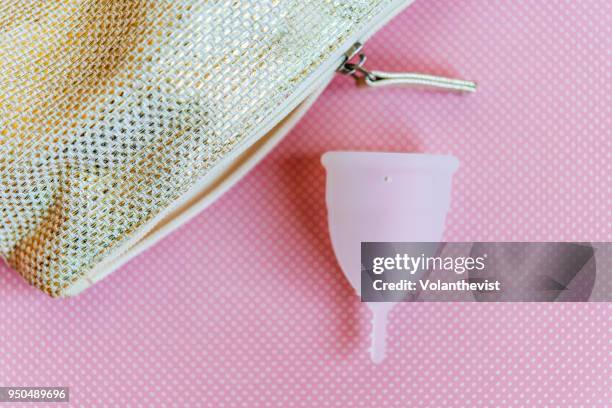 menstrual cup on pink background - menstrual cup stock pictures, royalty-free photos & images