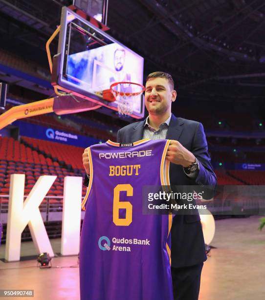 Andrew Bogut holds up a Kings singlet as he is unveiled as a Sydney Kings player at Qudos Bank Arena on April 24, 2018 in Sydney, Australia.