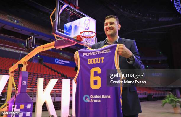 Andrew Bogut poses for photographs with a Kings singlet as he is unveiled as a Sydney Kings player at Qudos Bank Arena on April 24, 2018 in Sydney,...