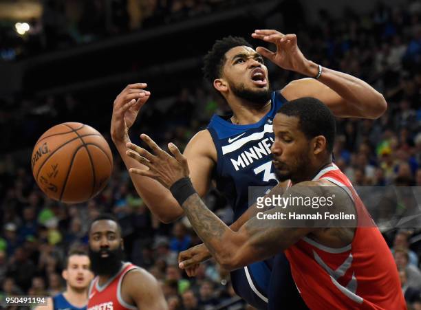 Trevor Ariza of the Houston Rockets fouls Karl-Anthony Towns of the Minnesota Timberwolves while shooting the ball during the fourth quarter in Game...