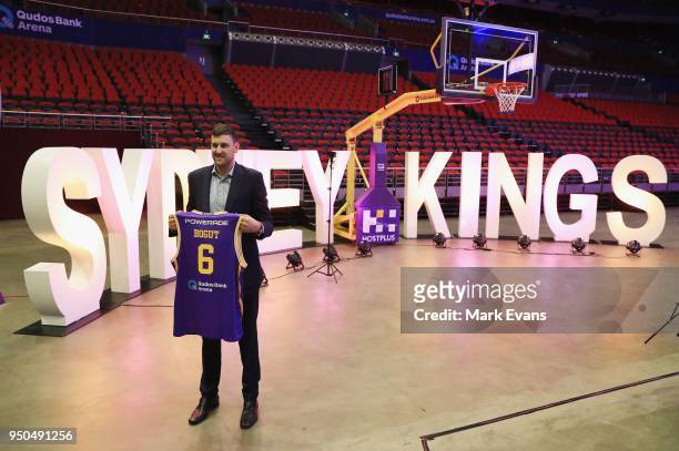 Andrew Bogut holds up a Kings singlet as he is unveiled as a Sydney Kings player at Qudos Bank Arena on April 24, 2018 in Sydney, Australia.