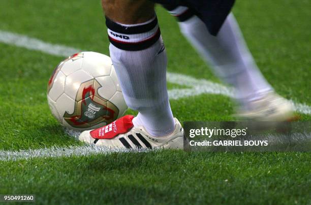 England's team captain and midfielder David Beckham gets ready to kick the ball with his custom-made Adidas Predator from the corner during match 5...