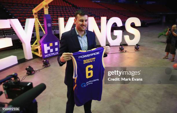 Andrew Bogut poses for photographs with a Kings singlet as he is unveiled as a Sydney Kings player at Qudos Bank Arena on April 24, 2018 in Sydney,...