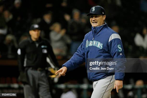 Manager Scott Servais of the Seattle Mariners reacts after talking with the umpire crew after Daniel Vogelbach and Mike Zunino were called out on a...