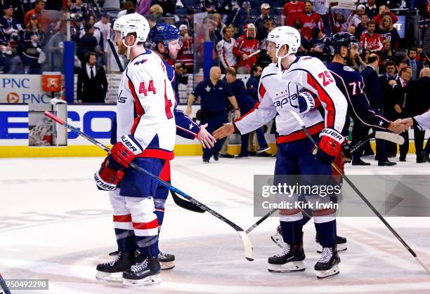 Thomas Vanek of the Columbus Blue Jackets shakes hands with Christian Djoos of the Washington Capitals at the end of Game Six of the Eastern...