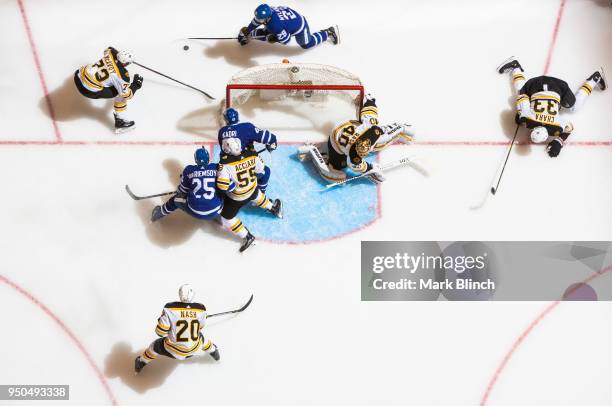 William Nylander of the Toronto Maple Leafs carries the puck behind the net of Tuukka Rask of the Boston Bruins in Game Six of the Eastern Conference...