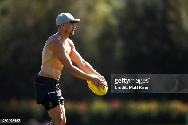 Brett Deledio of the Giants kicks during a GWS Giants Training Session at WestConnex Centre on April 24, 2018 in Sydney, Australia.