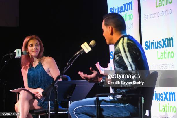 Billboard Executive Director of Content and Programming for Latin Music Leila Cobo and singer Victor Manuelle speak during a SiriusXM Town Hall at...