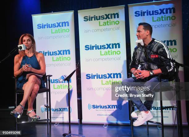 Billboard Executive Director of Content and Programming for Latin Music Leila Cobo and singer Victor Manuelle speak during a SiriusXM Town Hall at...