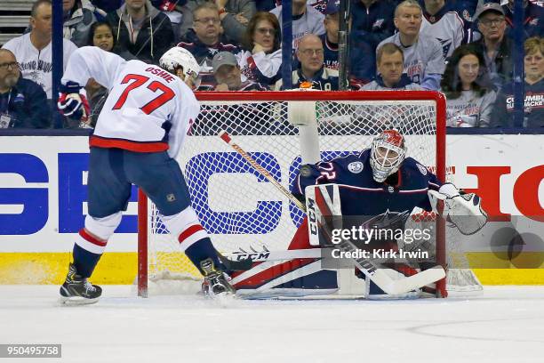 Sergei Bobrovsky of the Columbus Blue Jackets stops a shot from T.J. Oshie of the Washington Capitals in Game Four of the Eastern Conference First...