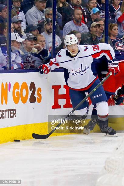 Alex Chiasson of the Washington Capitals controls the puck in Game Four of the Eastern Conference First Round during the 2018 NHL Stanley Cup...