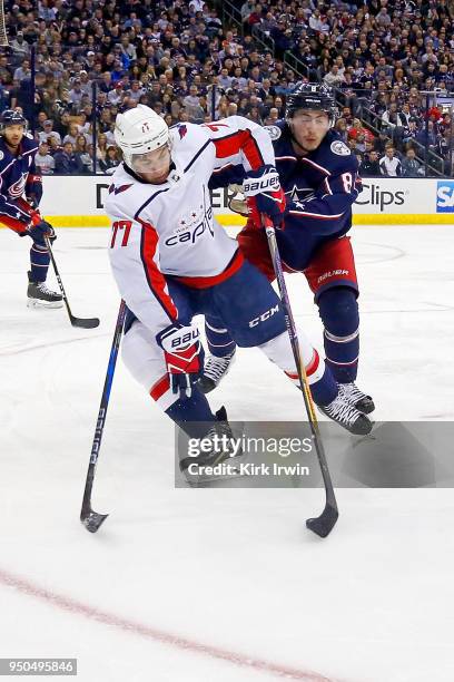 Oshie of the Washington Capitals and Zach Werenski of the Columbus Blue Jackets battle for control of the puck in Game Four of the Eastern Conference...