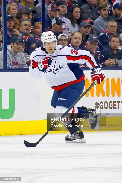 Alex Chiasson of the Washington Capitals controls the puck in Game Four of the Eastern Conference First Round during the 2018 NHL Stanley Cup...