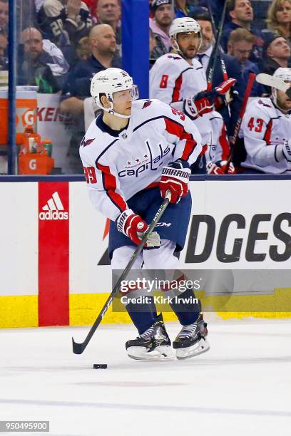 Alex Chiasson of the Washington Capitals controls the puck in Game Four of the Eastern Conference First Round during the 2018 NHL Stanley Cup...