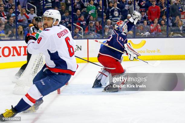 Sergei Bobrovsky of the Columbus Blue Jackets stops a shot from Alex Ovechkin of the Washington Capitals in Game Four of the Eastern Conference First...