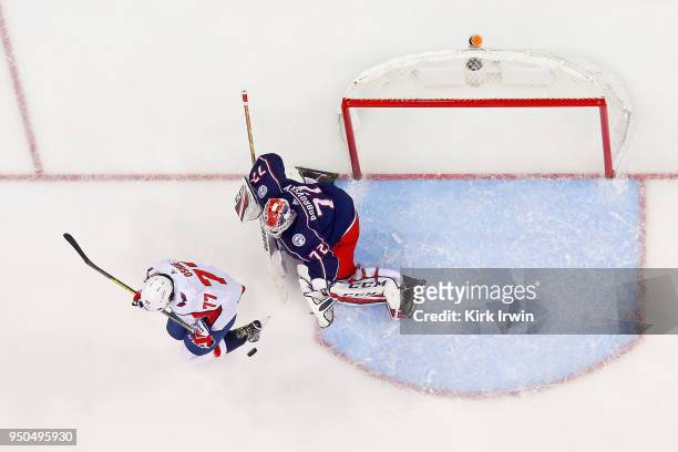 Oshie of the Washington Capitals attempts to screen Sergei Bobrovsky of the Columbus Blue Jackets from a shot in Game Four of the Eastern Conference...
