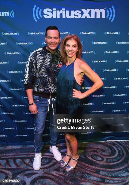 Singer Victor Manuelle and Billboard Executive Director of Content and Programming for Latin Music Leila Cobo attend a SiriusXM Town Hall at Rhythms...