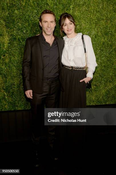 Alessandro Nivola and Emily Mortimer attend the CHANEL Tribeca Film Festival Artists Dinner at Balthazar. Emily Mortimer wears a CHANEL blouse with...