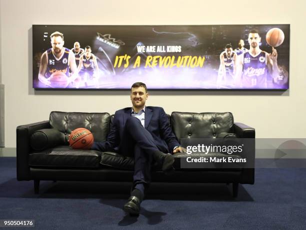 Andrew Bogut poses for photographs with a Kings singlet as he is unveiled as a Sydney Kings player at Qudos Bank Arena on April 24, 2018 in Sydney,...
