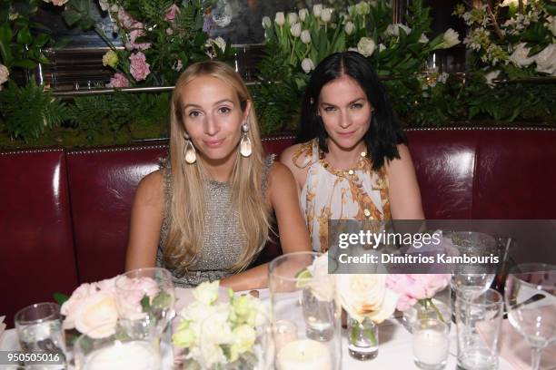 Harley Viera Newton, wearing a beige and silver iridescent tweed dress, Look 26, from the Cruise 2017/18 Collection with a CHANEL Bag, and Leigh...