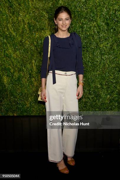 Natalya Poniatowski wears CHANEL jeans with a navy cupro and polyester pullover from the Cruise 2017/18 Collection with aCHANEL Bag at the CHANEL...