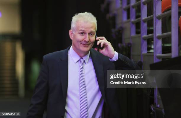 Andrew Gaze, Coach of the Sydney Kings, speaks on the phone after a press conference unveiling Andrew Bogut as a Sydney Kings player at Qudos Bank...