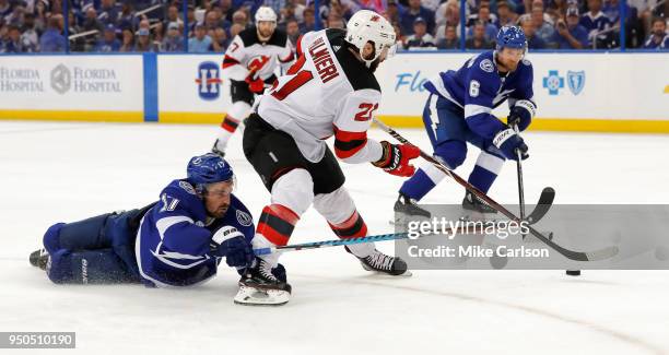 Kyle Palmieri of the New Jersey Devils fights off the check of Alex Killorn of the Tampa Bay Lightning in the third period of Game Five of the...