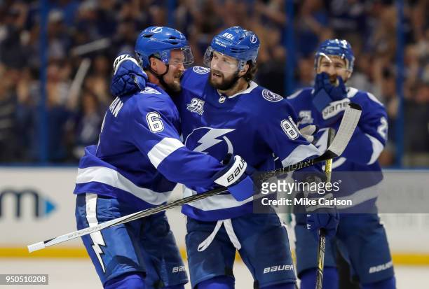 Nikita Kucherov of the Tampa Bay Lightning celebrates a goal against the New Jersey Devils with teammate Anton Stralman in the third period of Game...