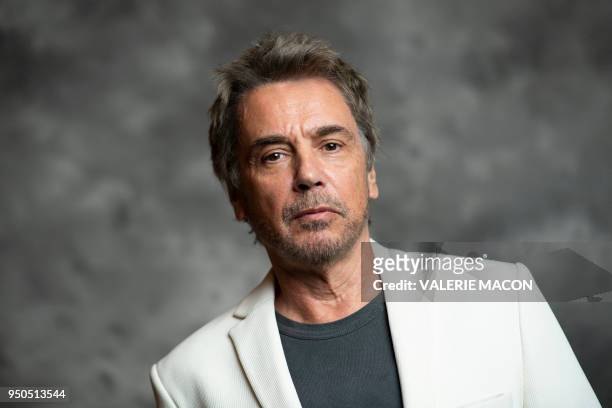 French composer Jean-Michel Jarre poses during the opening night of the 2018 COLCOA French Film Festival, April 23, 2018 at the Directors Guild of...