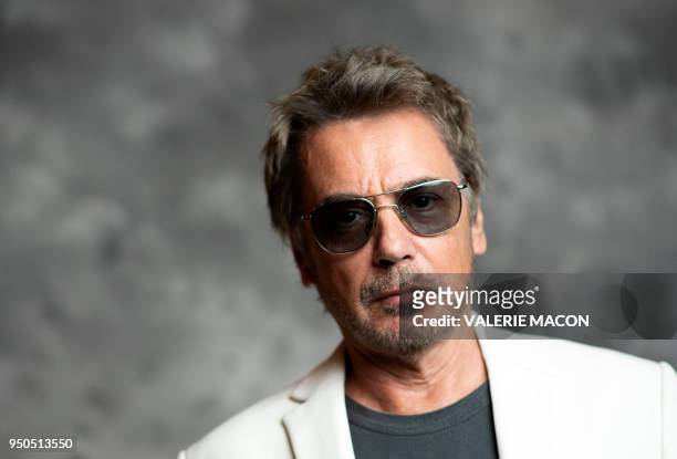 French composer Jean-Michel Jarre poses during the opening night of the 2018 COLCOA French Film Festival, April 23, 2018 at the Directors Guild of...
