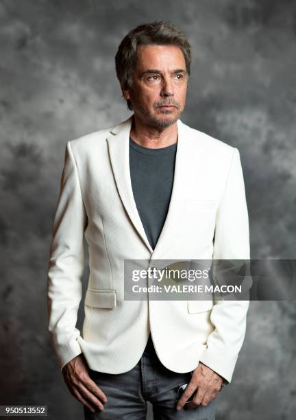 French composer Jean-Michel Jarre poses during the opening night of the 2018 COLCOA French Film Festival, April 23, 2018 at the Directors Guild of...