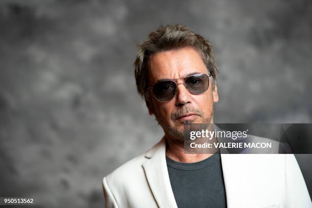 French composer Jean-Michel Jarre poses during the opening night of the 2018 COLCOA French Film Festival, April 23, 2018 at the Directors Guild of...