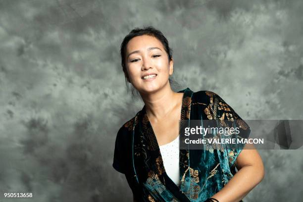 Actress Gong Li poses during the opening night of the 2018 COLCOA French Film Festival, April 23, 2018 at the Directors Guild of America Theater in...
