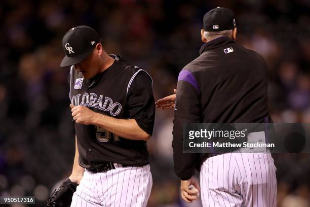 Manager Bud Black of the Colorado Rockies removes pitcher Jake McGee in the seventh inning against the San Diego Padres at Coors Field on April 23,...