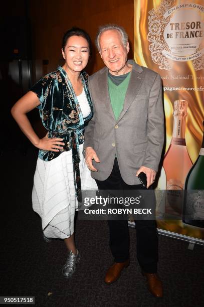 Actress Gong Li and director Michael Mann arrive for the opening night of the 2018 COLCOA French Film Festival, April 23, 2018 at the Directors Guild...