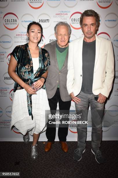 Actress Gong Li, director Michael Mann and recording artist Jean-Michel Jarre arrive for the opening night of the 2018 COLCOA French Film Festival,...